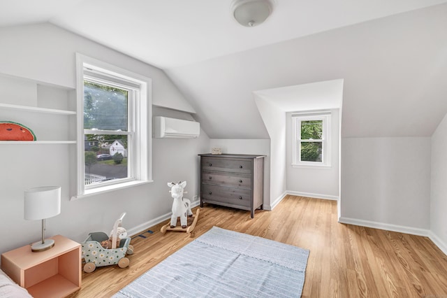 435 Lenox Rd, Fairfield, CT 06825 - bonus room featuring an AC wall unit, lofted ceiling, wood finished floors, and baseboards