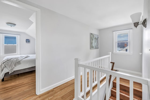 435 Lenox Rd, Fairfield, CT 06825 - corridor with an upstairs landing, light wood-style floors, vaulted ceiling, and baseboards