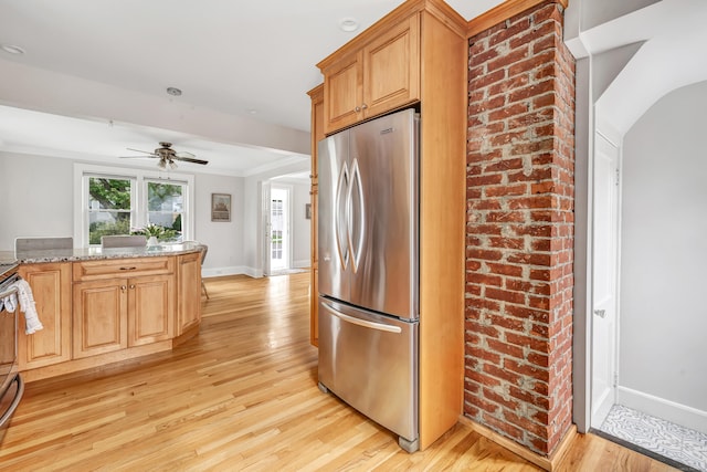 435 Lenox Rd, Fairfield, CT 06825 - kitchen featuring stainless steel fridge, light wood-style floors, baseboards, ceiling fan, and light stone countertops