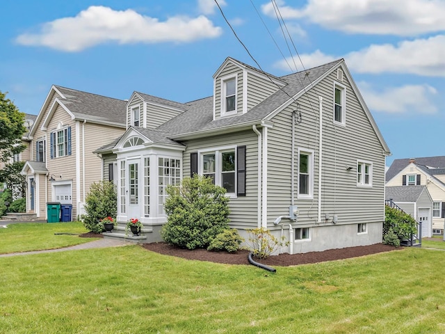435 Lenox Rd, Fairfield, CT 06825 - cape cod house featuring a shingled roof and a front lawn