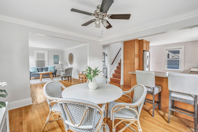 435 Lenox Rd, Fairfield, CT 06825 - dining room featuring light wood-type flooring, a ceiling fan, stairway, baseboards, and ornamental molding