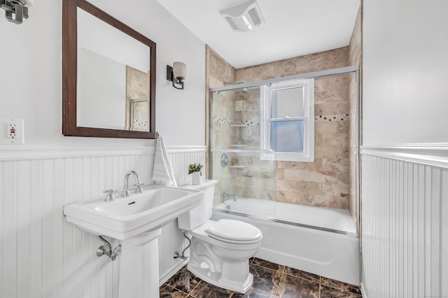 435 Lenox Rd, Fairfield, CT 06825 - full bathroom featuring a wainscoted wall, toilet, and combined bath / shower with glass door