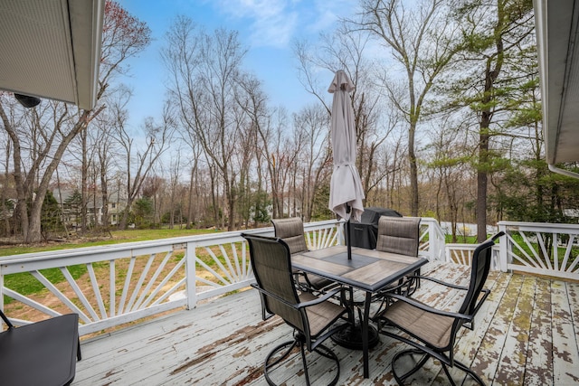 wooden deck featuring outdoor dining space