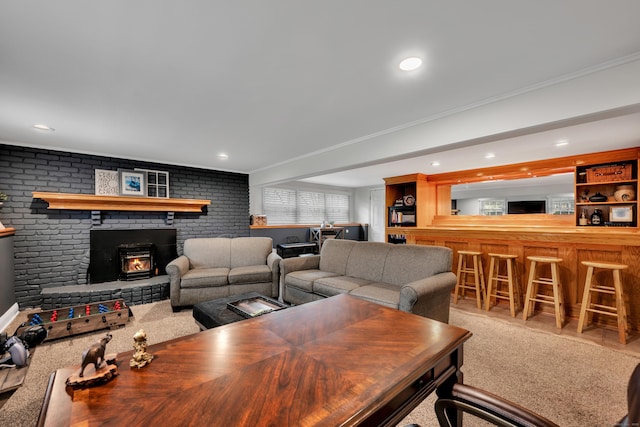 living area featuring crown molding, carpet floors, a dry bar, and a fireplace