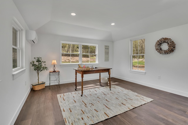 home office with an AC wall unit, wood finished floors, baseboards, and recessed lighting