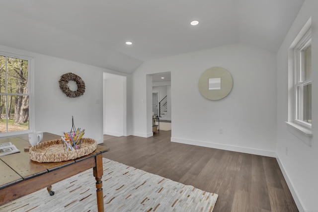 living area with lofted ceiling, dark wood-style floors, baseboards, recessed lighting, and stairway