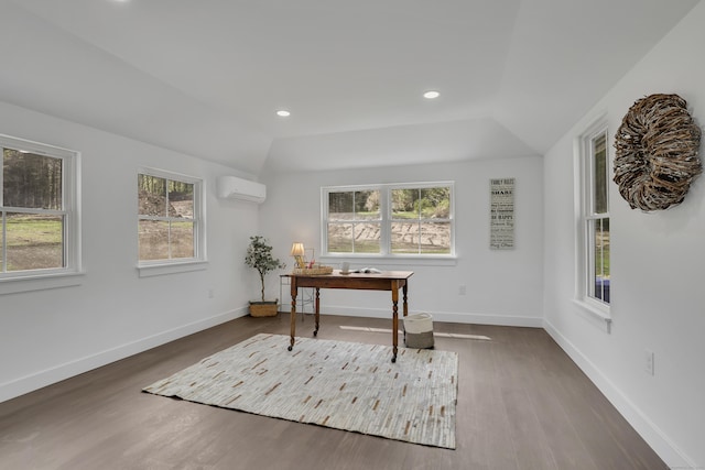 home office with a wall mounted AC, plenty of natural light, wood finished floors, and recessed lighting