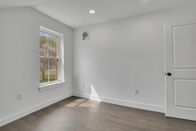 unfurnished room with dark wood-type flooring, baseboards, and recessed lighting