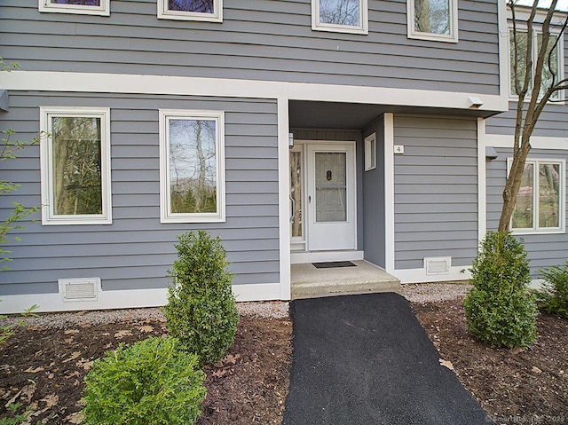 view of exterior entry featuring crawl space