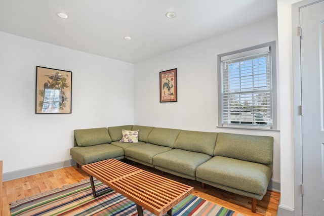 living room with wood finished floors, recessed lighting, and baseboards