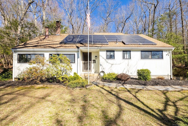 206 New Rd, Avon, CT 06001 - single story home featuring a chimney, roof mounted solar panels, a shingled roof, and a front yard