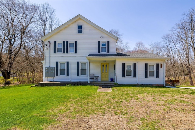 view of front of home with a front lawn and covered porch