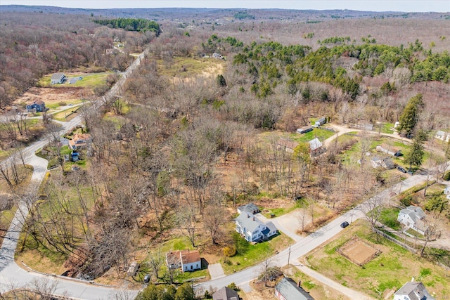 drone / aerial view with a view of trees