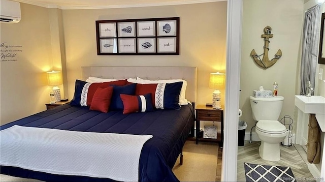bedroom with an AC wall unit, baseboards, and ornamental molding