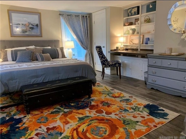 bedroom featuring wood finished floors
