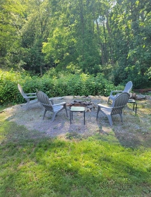 view of patio / terrace with a view of trees