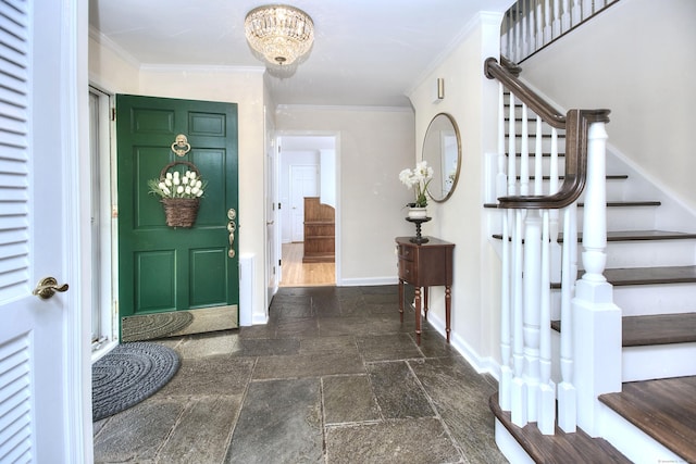 33 Pequot Trl, Westport, CT 06880 - entryway with stone tile floors, stairs, baseboards, a chandelier, and ornamental molding