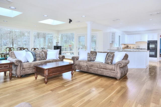 33 Pequot Trl, Westport, CT 06880 - living area with a skylight, light wood-type flooring, and recessed lighting