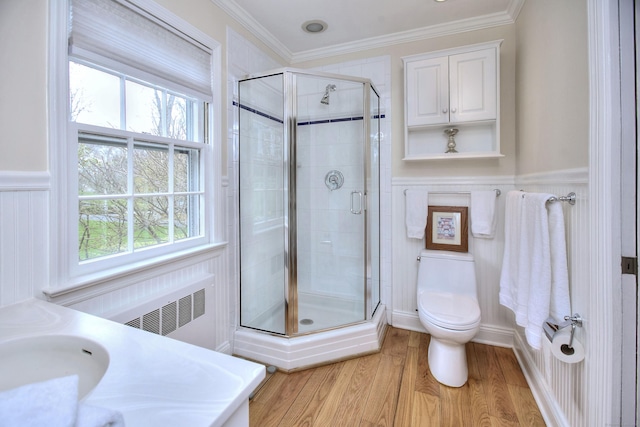 33 Pequot Trl, Westport, CT 06880 - bathroom featuring a stall shower, wood finished floors, toilet, radiator, and crown molding