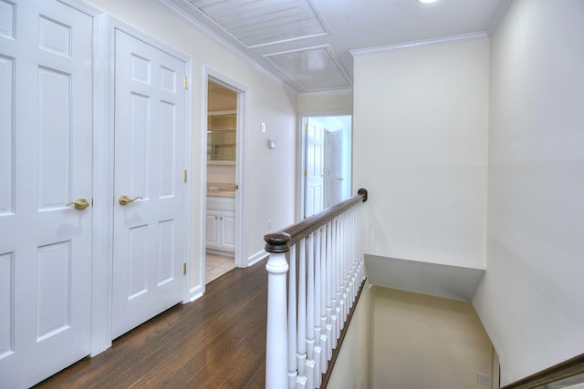 33 Pequot Trl, Westport, CT 06880 - hall with attic access, dark wood-type flooring, an upstairs landing, crown molding, and baseboards