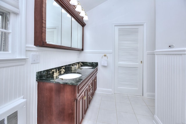 33 Pequot Trl, Westport, CT 06880 - full bath with wainscoting, double vanity, and tile patterned floors