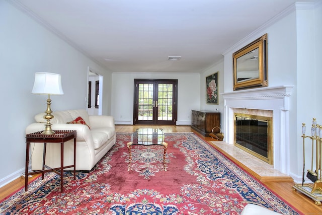 33 Pequot Trl, Westport, CT 06880 - living area with wood finished floors, a high end fireplace, a baseboard radiator, and ornamental molding