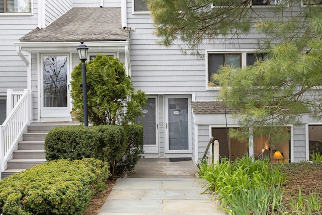 201 Rowayton Woods Dr Unit 201, Norwalk, CT 06854 - view of exterior entry with roof with shingles