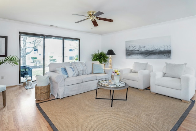 201 Rowayton Woods Dr Unit 201, Norwalk, CT 06854 - living area featuring visible vents, light wood-style floors, ceiling fan, and crown molding