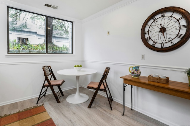 201 Rowayton Woods Dr Unit 201, Norwalk, CT 06854 - dining space with baseboards, visible vents, breakfast area, wood finished floors, and crown molding