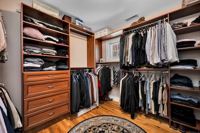 spacious closet with visible vents and light wood-style flooring