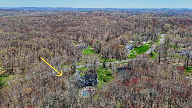 birds eye view of property with a forest view