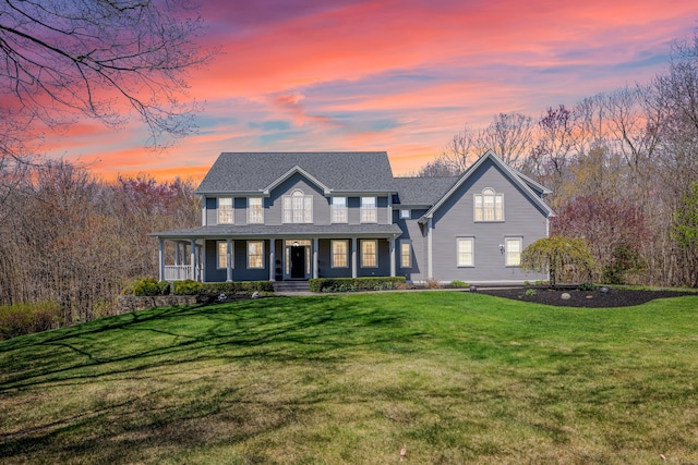view of front of house featuring a front lawn and covered porch