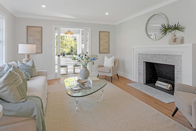 4 Rabbit Ln, Darien, CT 06820 - living area with a fireplace, wood finished floors, crown molding, and baseboards