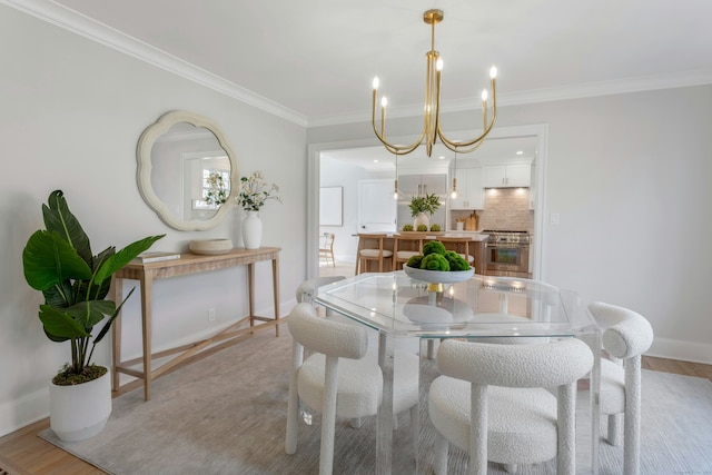 4 Rabbit Ln, Darien, CT 06820 - dining space featuring a notable chandelier, baseboards, light wood-style floors, and ornamental molding