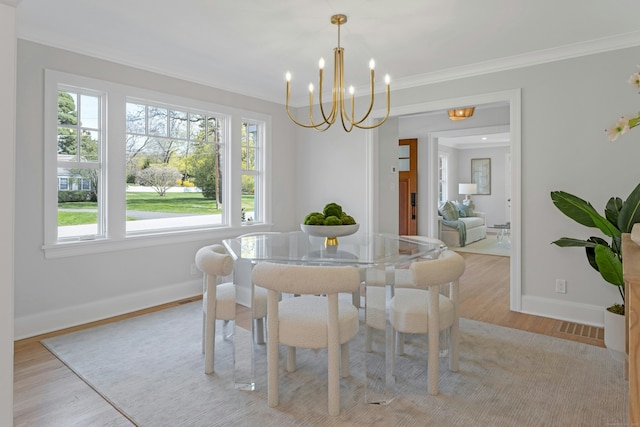 4 Rabbit Ln, Darien, CT 06820 - dining area featuring a notable chandelier, light wood finished floors, baseboards, ornamental molding, and visible vents