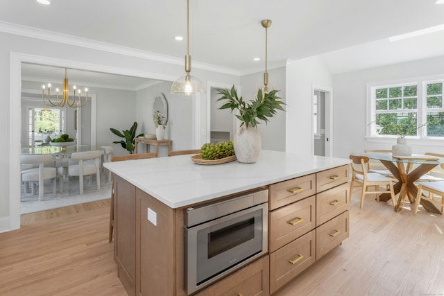 4 Rabbit Ln, Darien, CT 06820 - kitchen featuring light countertops, light wood-type flooring, pendant lighting, and an inviting chandelier