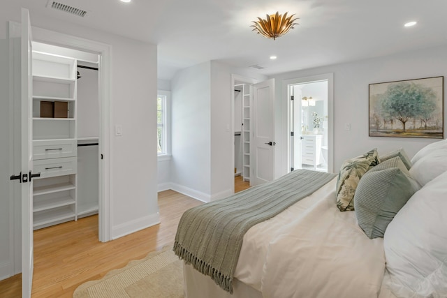4 Rabbit Ln, Darien, CT 06820 - bedroom with light wood finished floors, visible vents, a walk in closet, a closet, and baseboards