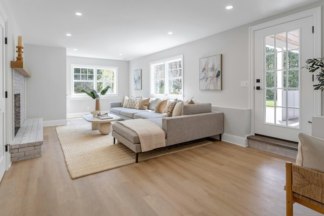 4 Rabbit Ln, Darien, CT 06820 - living room featuring baseboards, recessed lighting, a brick fireplace, and light wood-type flooring