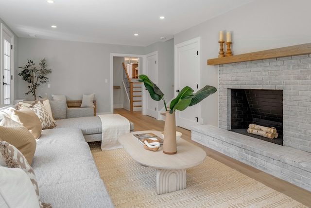 4 Rabbit Ln, Darien, CT 06820 - living room featuring recessed lighting, stairway, a fireplace, and wood finished floors