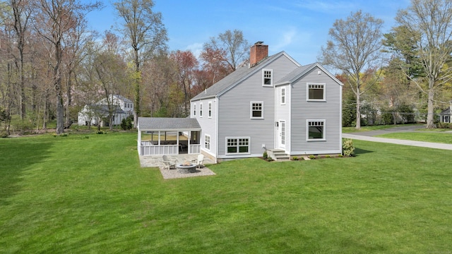 4 Rabbit Ln, Darien, CT 06820 - back of house with a fire pit, a chimney, and a yard