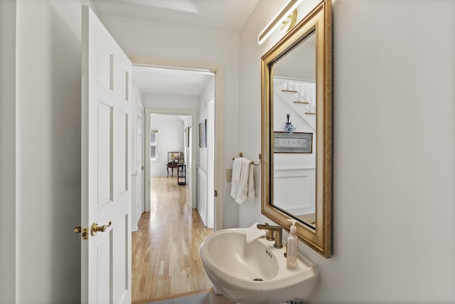 bathroom featuring a sink and wood finished floors