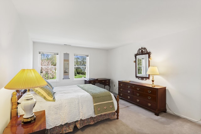 carpeted bedroom with visible vents
