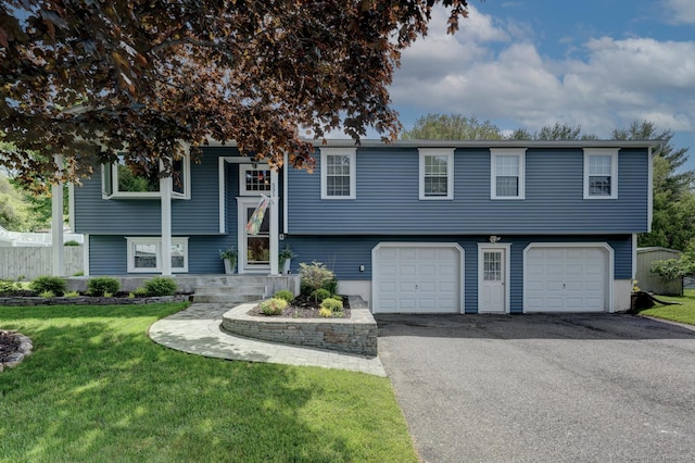 531 Oxbow Dr, Torrington, CT 06790 - bi-level home with an attached garage and driveway