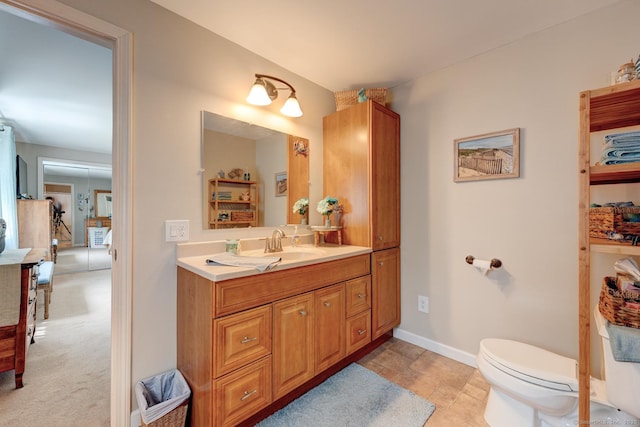 531 Oxbow Dr, Torrington, CT 06790 - bathroom featuring vanity, toilet, and baseboards