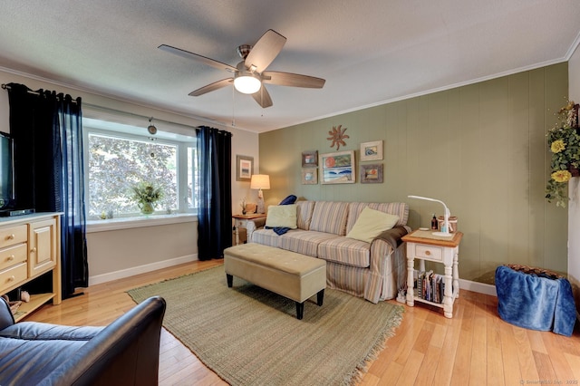 531 Oxbow Dr, Torrington, CT 06790 - living area with light wood finished floors, ceiling fan, baseboards, and crown molding