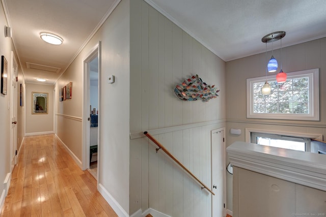 531 Oxbow Dr, Torrington, CT 06790 - hall with light wood-type flooring, baseboards, an upstairs landing, and ornamental molding