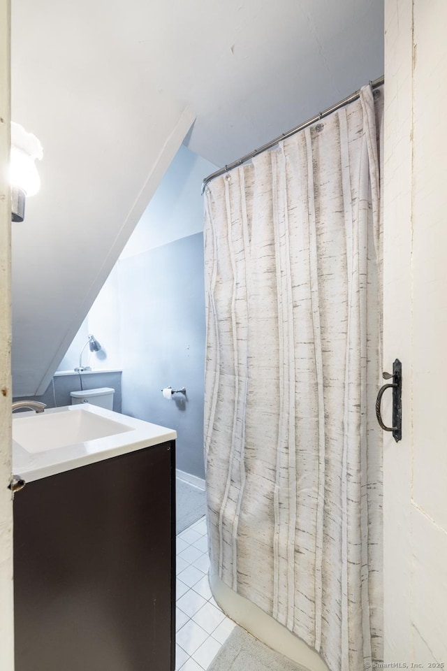 bathroom with tile patterned flooring and vanity