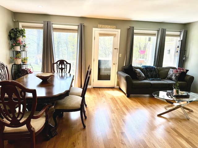 dining area with light wood-style floors, recessed lighting, and plenty of natural light