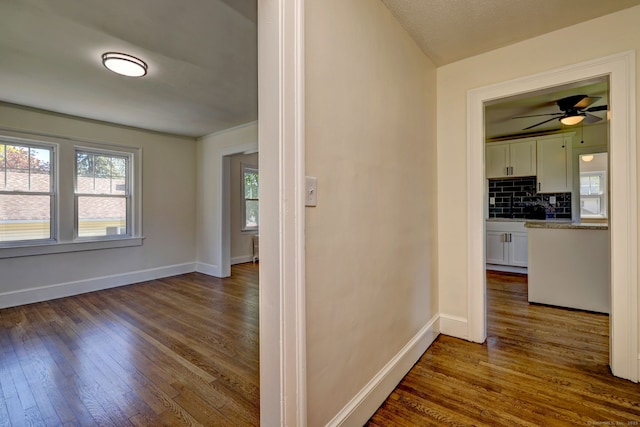 53 Bina Ave, Windsor, CT 06095 - hallway with dark wood finished floors and baseboards
