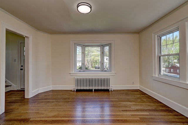 53 Bina Ave, Windsor, CT 06095 - spare room with radiator heating unit, wood finished floors, crown molding, and baseboards